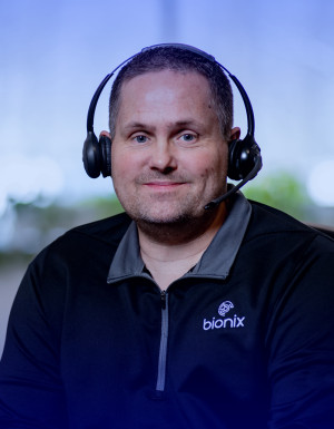 Smiling customer service individual.